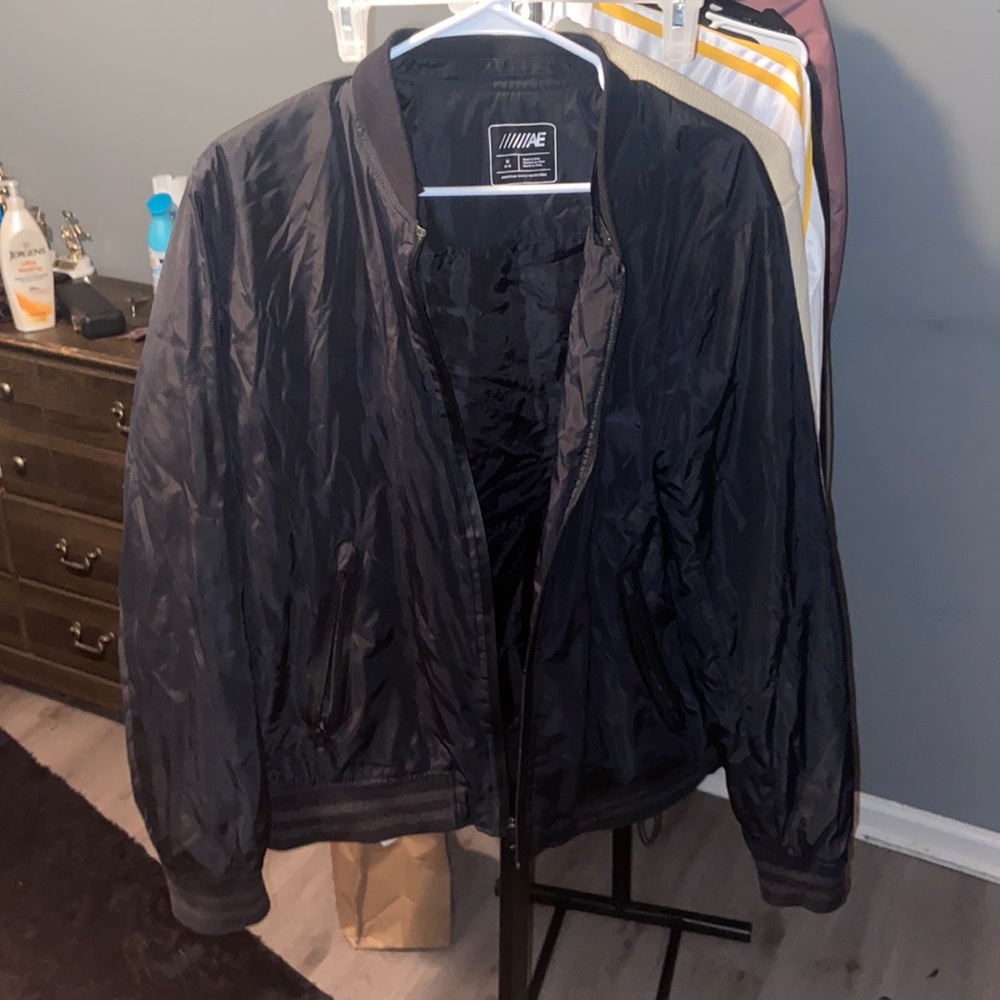 Black American eagle bomber jacket.
